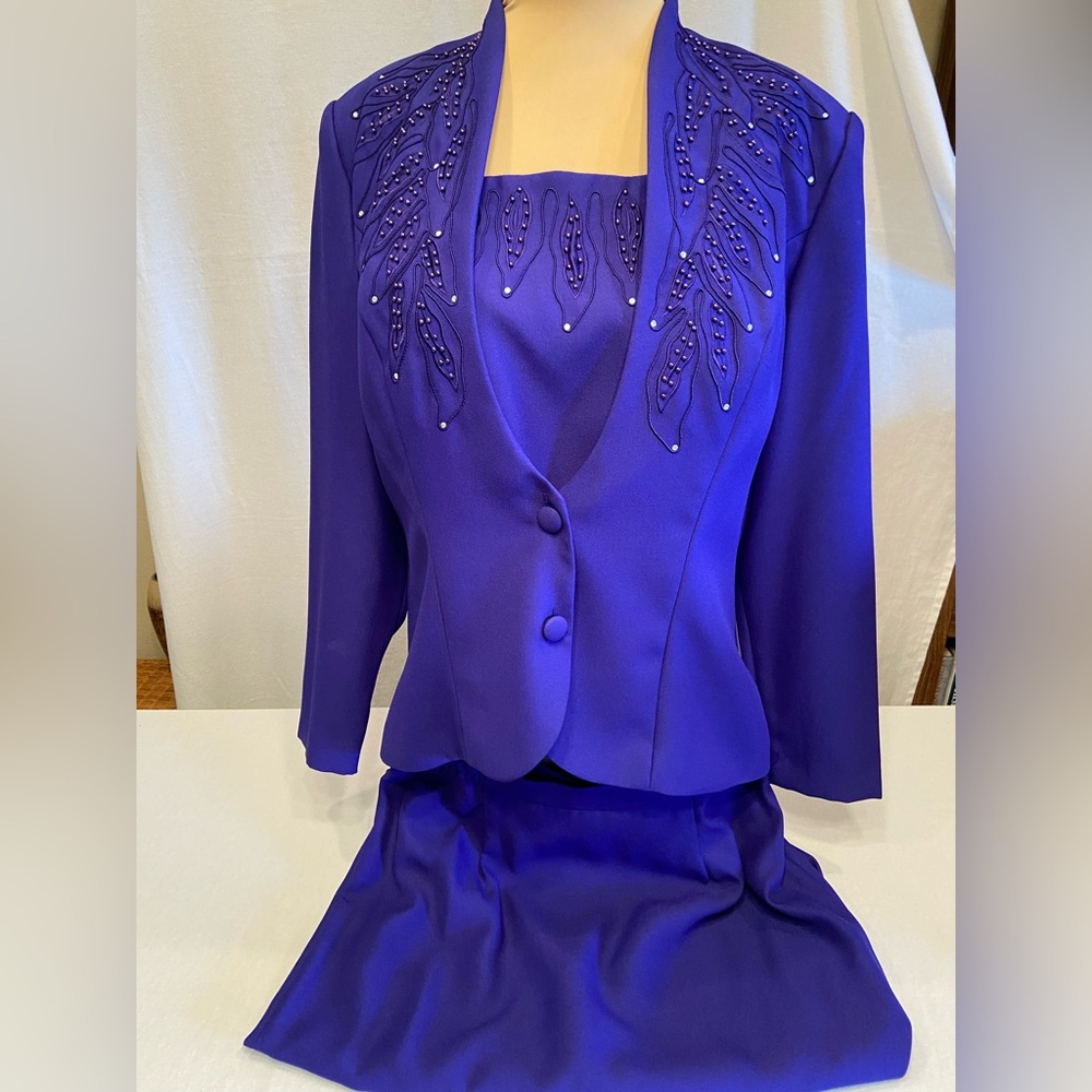 V-4 Vintage
Purple suit jacket and skirt . Never worn.